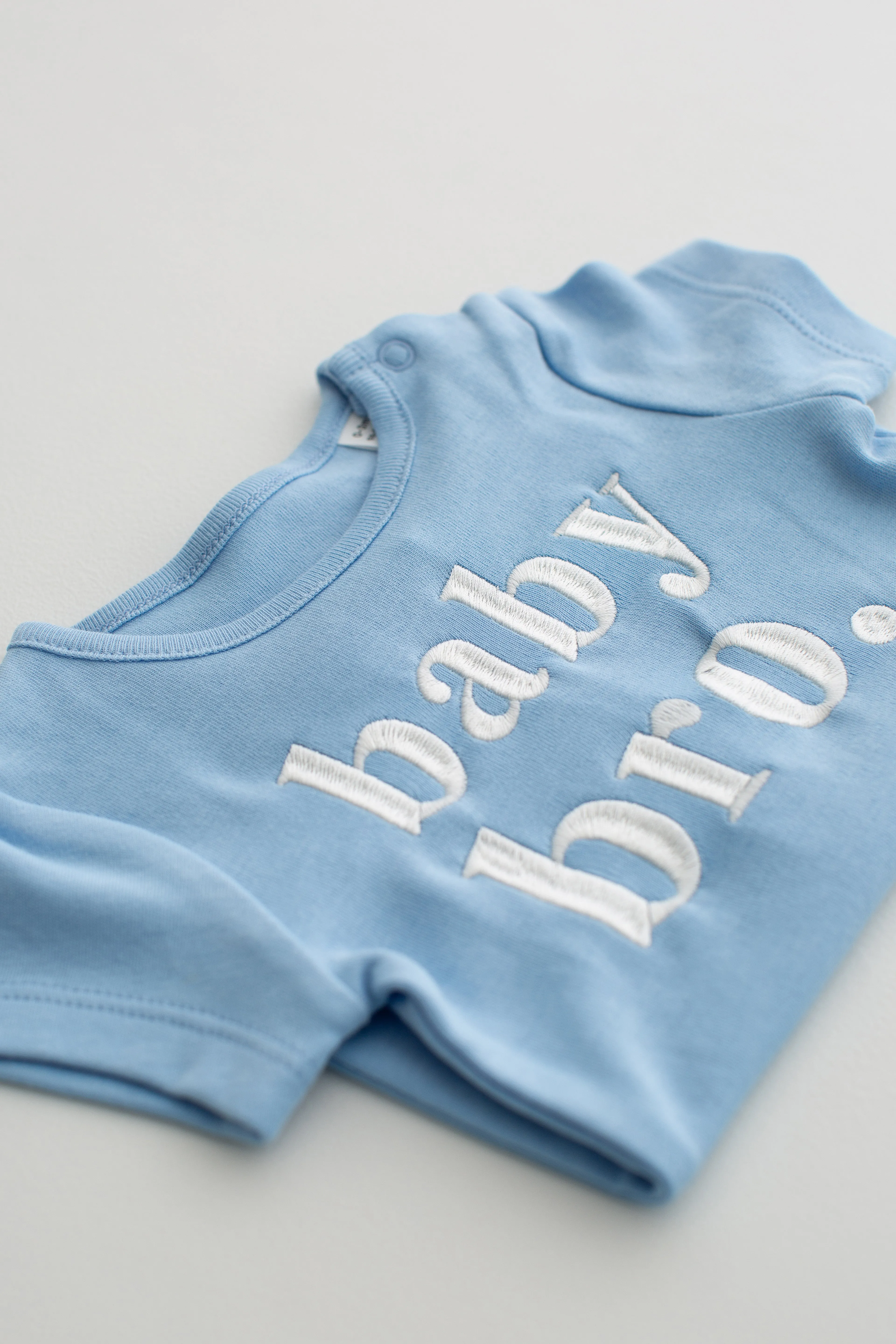 baby bro/sis Signature Baby Bodysuit